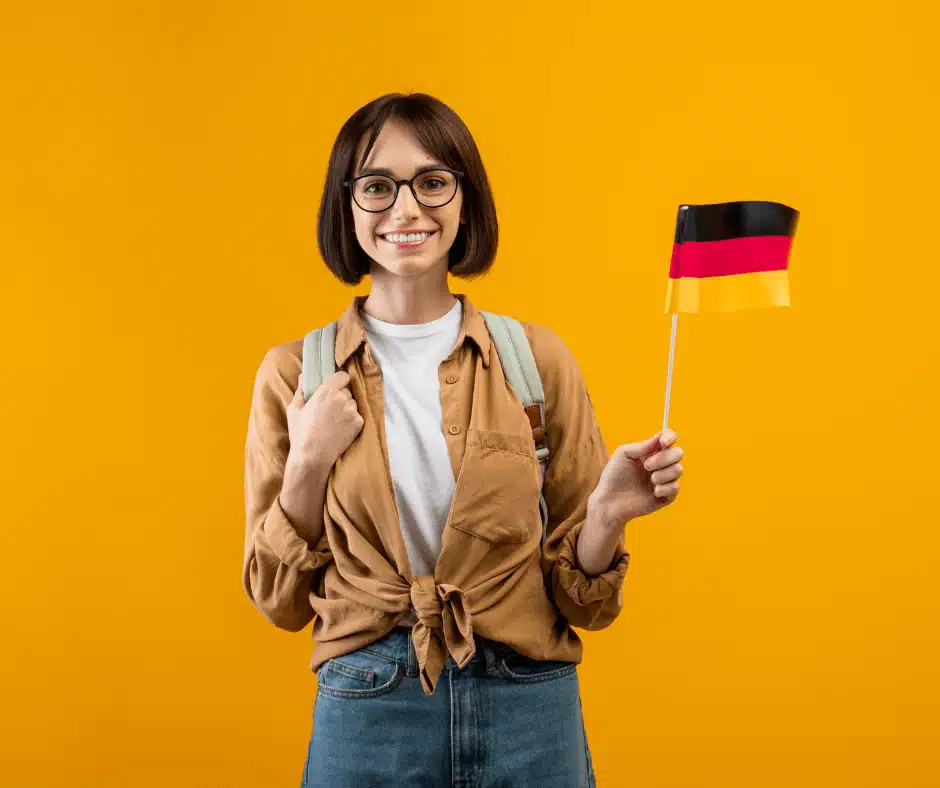Kobieta pracująca w Niemczech z flagą Niemiec